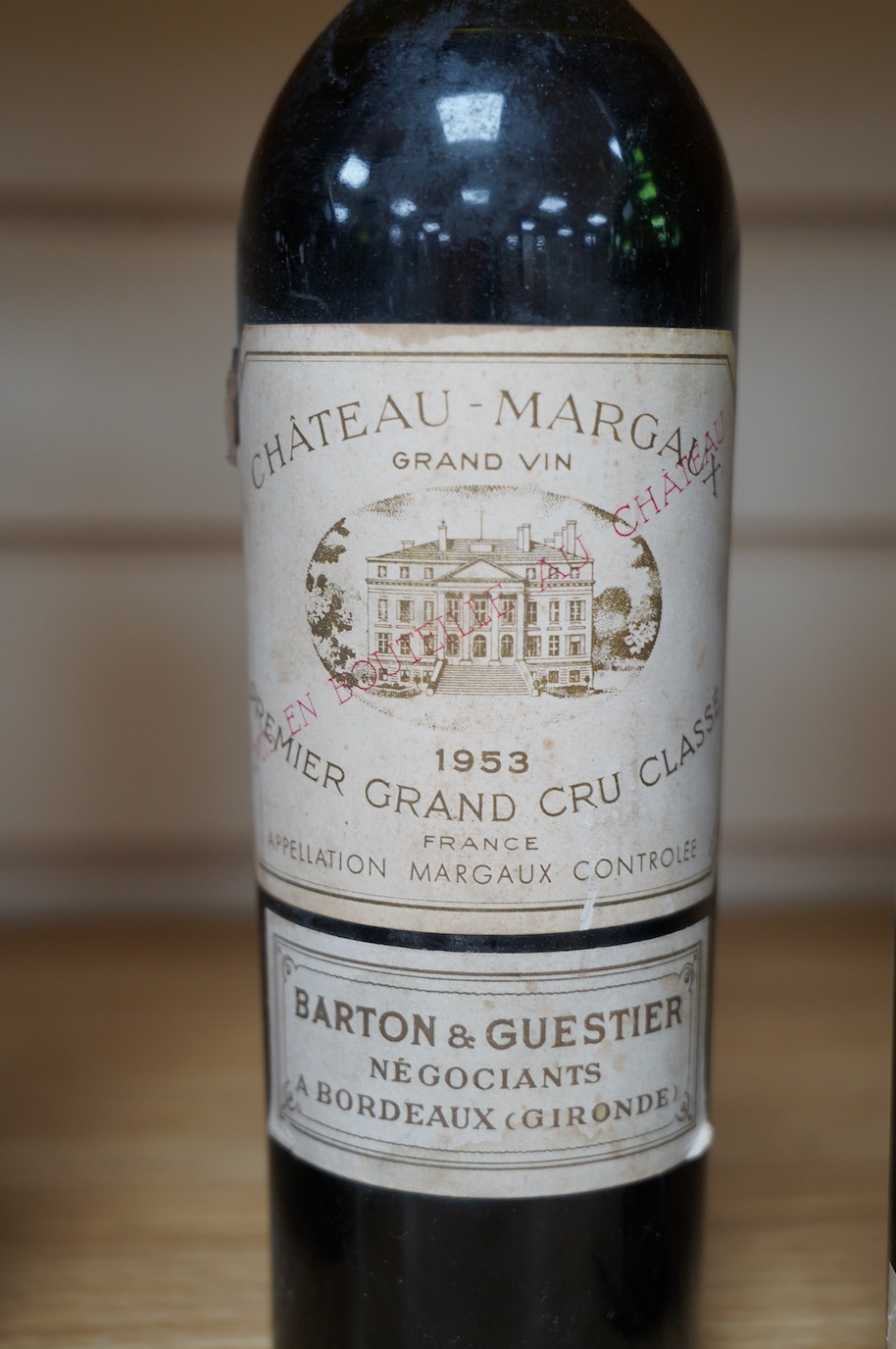 Four bottles of red wine; a Chateau Latour 1953, a Chateau Margaux 1953, a Chateau Mouton Rothschild, 1962, and a Chateau Rothschild 1952. Condition - fair to good, some foxing and peeling etc to labels